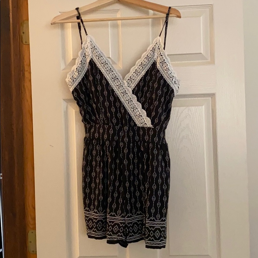 Elegant brand new Romper Size Medium (4-6)